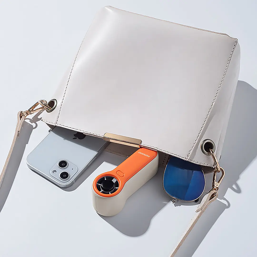 Porodo Lifestyle Pocket Size Handheld Fan - White/Orange 3 Porodo Lifestyle Pocket Size Handheld Fan - White/Orange - Image 3